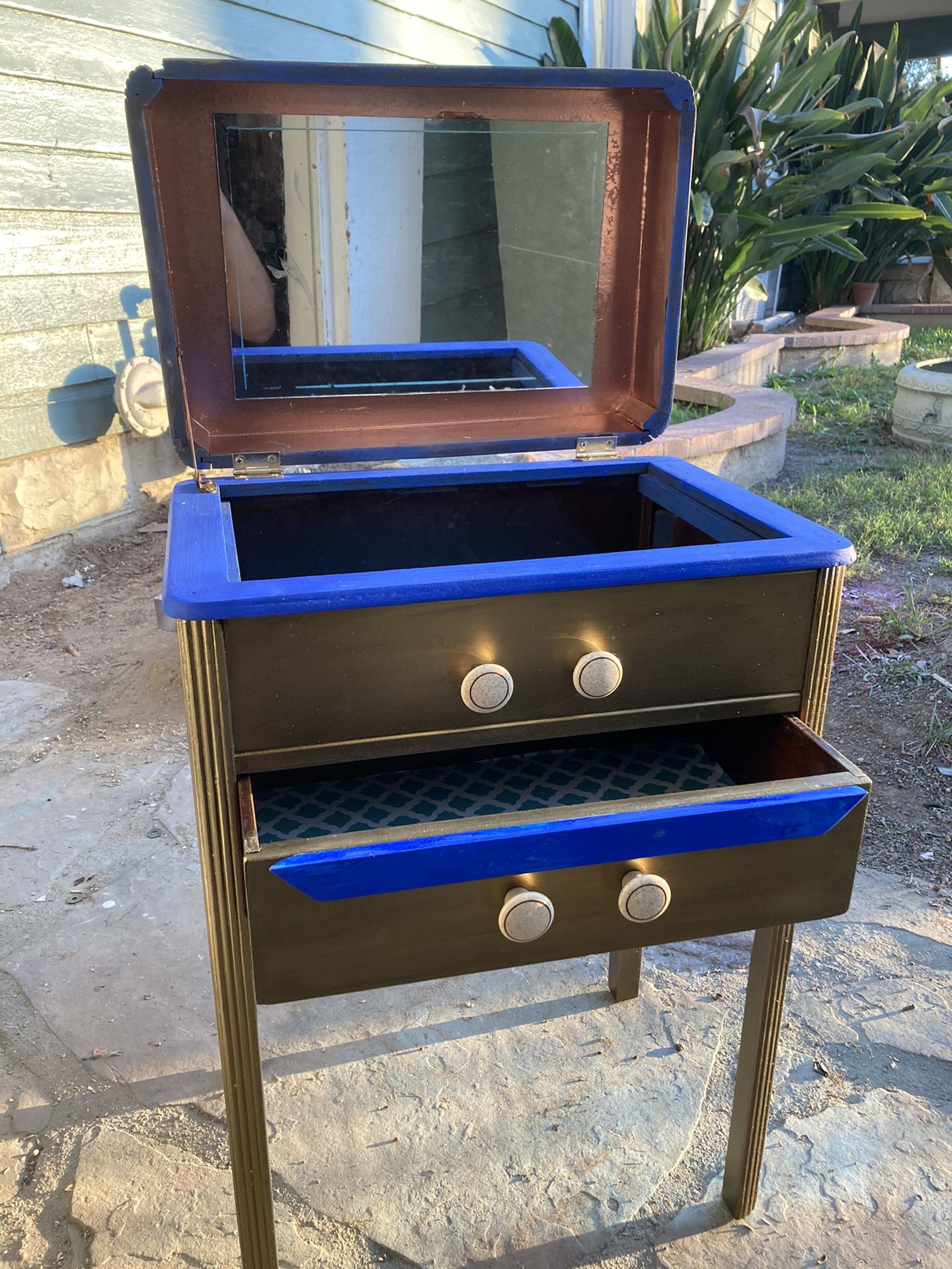 Small stand up jewelry box w/ metallic all around acrylic paint and cobalt hue detail. Mirror and lined drawer.