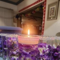 12 glass centerpieces with floating candles