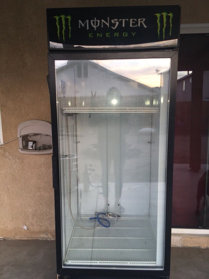 Monster Energy Drink Refrigerator converted in to a kegerator.comes with keg and two taps.works great