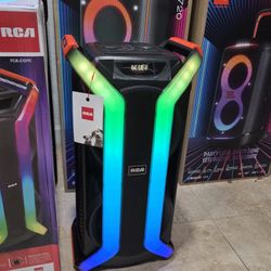 Portable and rechargeable speaker with bluetooth and party lights! Microphone included.