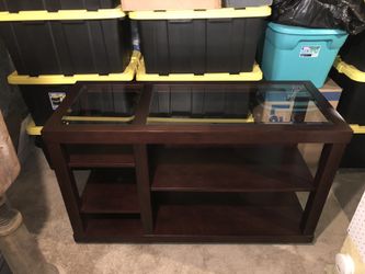 Wooden table with glass top
