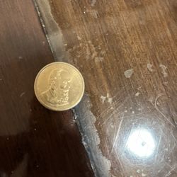 This image displays a Rutherford B. Hayes Presidential $1 coin.  