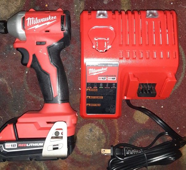 Milwaukee 1/4" Impact Drill, Battery, And Charger