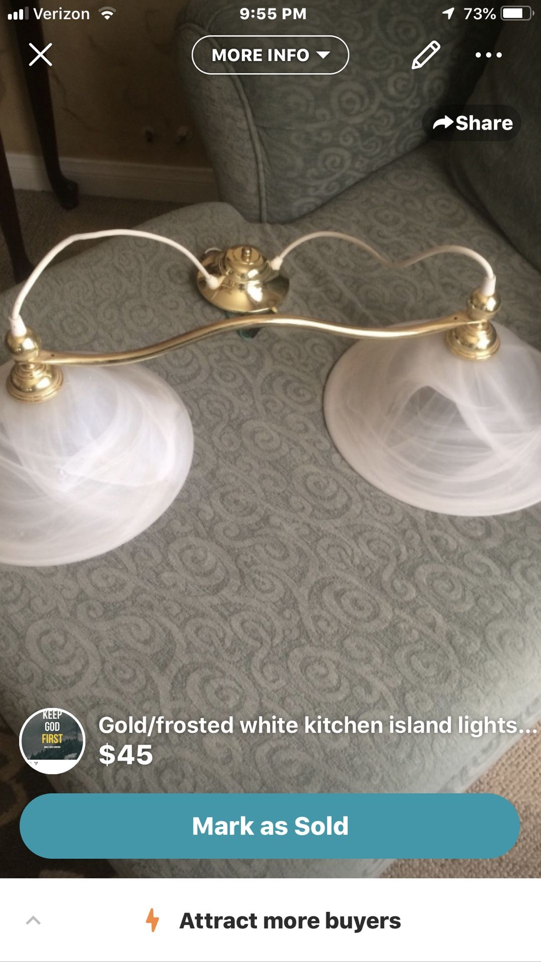 Gold/frosted white kitchen island fixture.