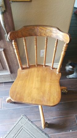 Antique solid oak swivel desk chair with brass wheels