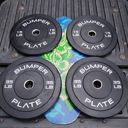SET  OF  NEW   OLYMPIC  CAP  15.  LB &  35. LB. BUMPER  PLATES