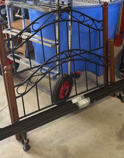Full size bed frame.  Headboard, footboard, and frame.  No wooden slats.    Located in Cibolo