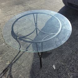Vintage Wrought Iron & Glass Dining Table
 With matching chairs that need new cushion.