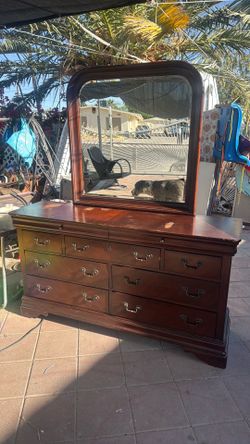 Traditional long chest dresser with a mirror