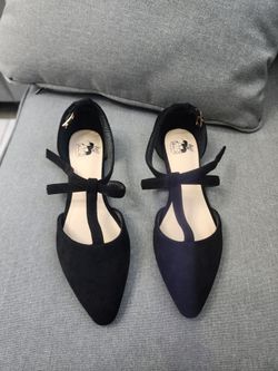 Black suede Mary Jane flats with gold buckle detail