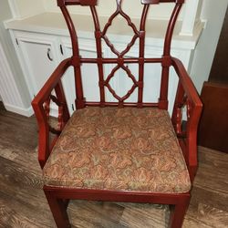 2 Elegant, traditional mahogany armchairs with ￼ intricate fretwork back