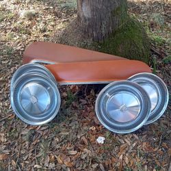 70's model Cadillac Hubcaps And  Set Of Skirts