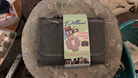 Diaper changing pad with storage