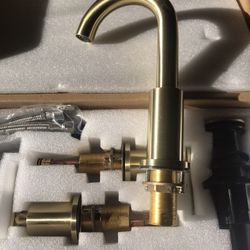 New gold bathroom sink faucet in box