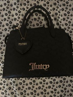 Juicy Couture black handbag with repeating monogram pattern