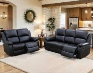 Black leather fully reclining couch and love seat