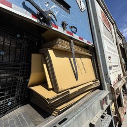 20FT TRAILER FULL OF FLATTENED CARDBOARD BOXES