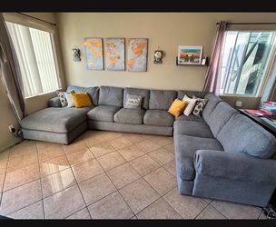 Beautiful Grey Sectional couch from Jerome’s