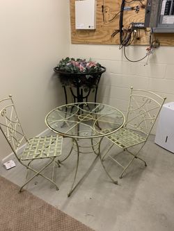 Pier 1 wrought iron table and two chairs