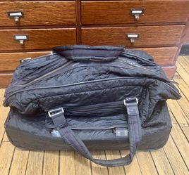 Black Quilted Rolling Duffel Bag with Telescoping Handle