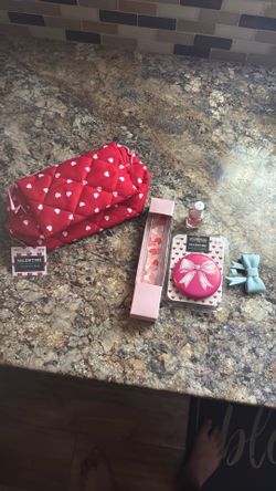 Small makeup bag with new mirror and bottle of nail polish