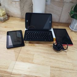 Two Kindles and one IPad with Keyboard.