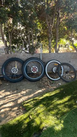 Two sets of 26 inch rims and tires with electric motor