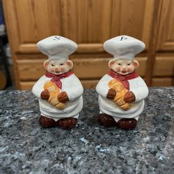 Vintage Ceramic Chef Pig Pair of Salt and Pepper Shakers.  Size approximately 4 inches tall.  Preowned.  Has been on display in a cabinet with a very 