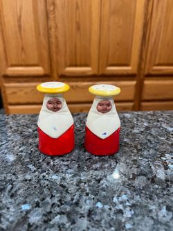 Vintage Woman”Pair of Salt and Peppers Shakers.  Size approximately 3 inches.  Preowned the top of one shaker one of the holes is bigger than the othe