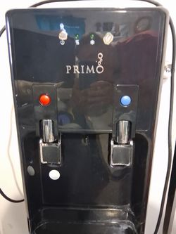 A 5 gallon water dispenser hot and cold