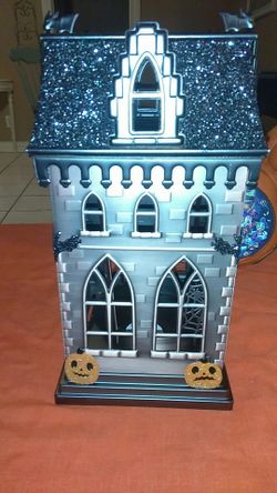 Haunted house candle holder