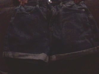 jean shorts and long sleeve holister top with a low cut neck line bunddle