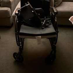 Cushioned Wheelchair With Footrests