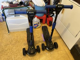 Pair Of Kimi Kids Electric Scooters