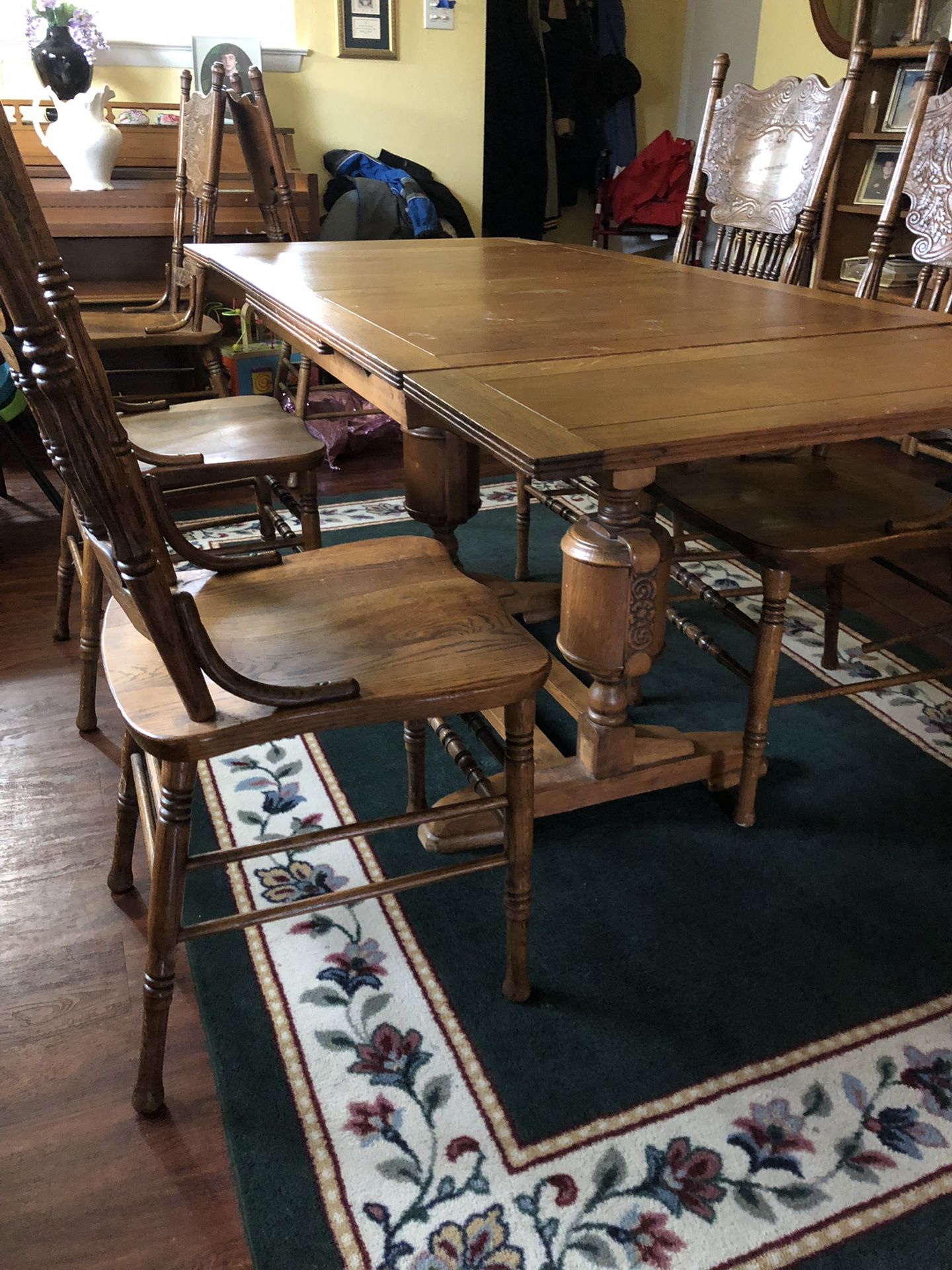 Antique Dining table that extends and breaks down with a centerpiece and four chairs