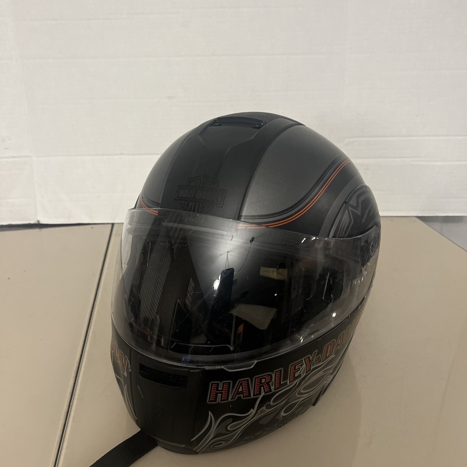 Harley Davidson Helmet HD-H05 SIZE L Good Condition with cosmetic blemishes. There are scratches and scuff marks throughout the helmet and they range