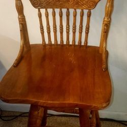 Two Vintage Pressed Back Oak Swivel Bar Stools