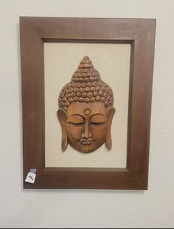 framed hand-carved wooden Buddha head wall plaque