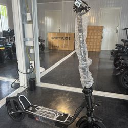 Electric scooter with shock absorber