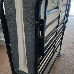 Twin size roll away bed with additional mattress for top