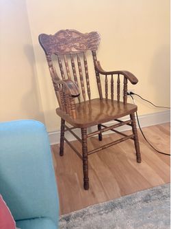Armchair with detailed carved backrest