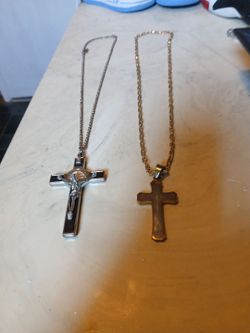 The silver chain with cross and gold plated chain with cross