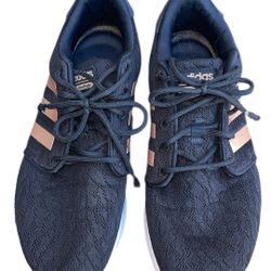 Adidas Cloudfoam QT Racer running shoes in black with copper or rose gold metallic stripes.