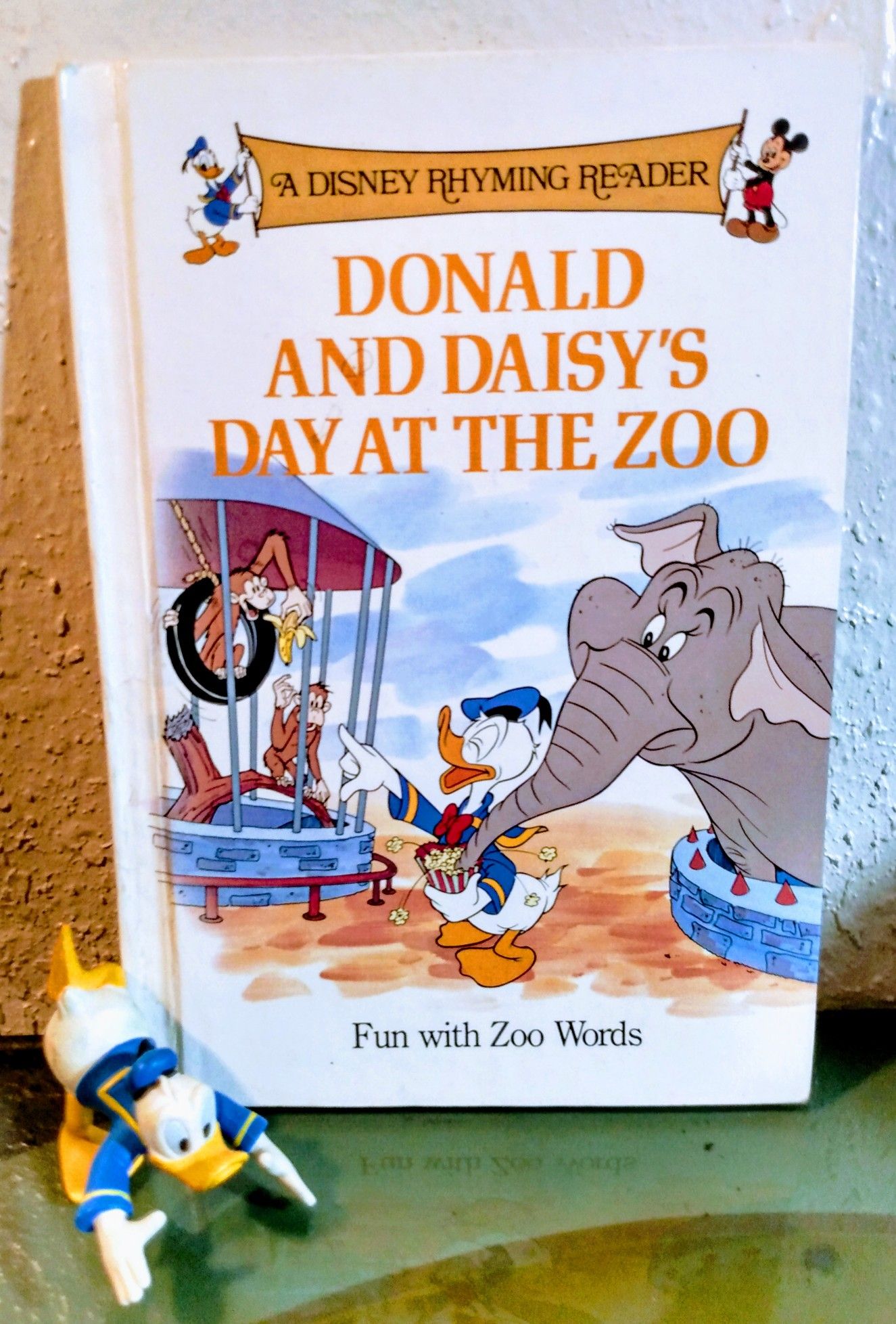 Disney rhyming reader + donald figurine