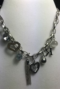 Fashion bracelet with charms. 7 inches and adjustable to 8 inches
