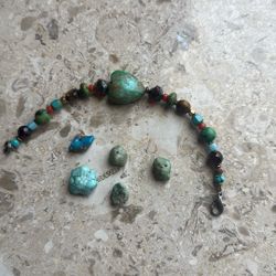 •  Woman's Bracelet with 9 turquoise and 2 tigereye stones,  @ 5 Inches long