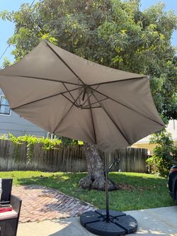 10 ft Patio Umbrella and  4 plate base stand