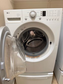LG washer and gas dryer with pedestals