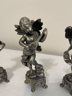 Set of four heavy pewter musician cherubs.  