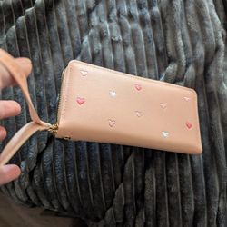 Brand new pink wallet with hearts and wristlet. 